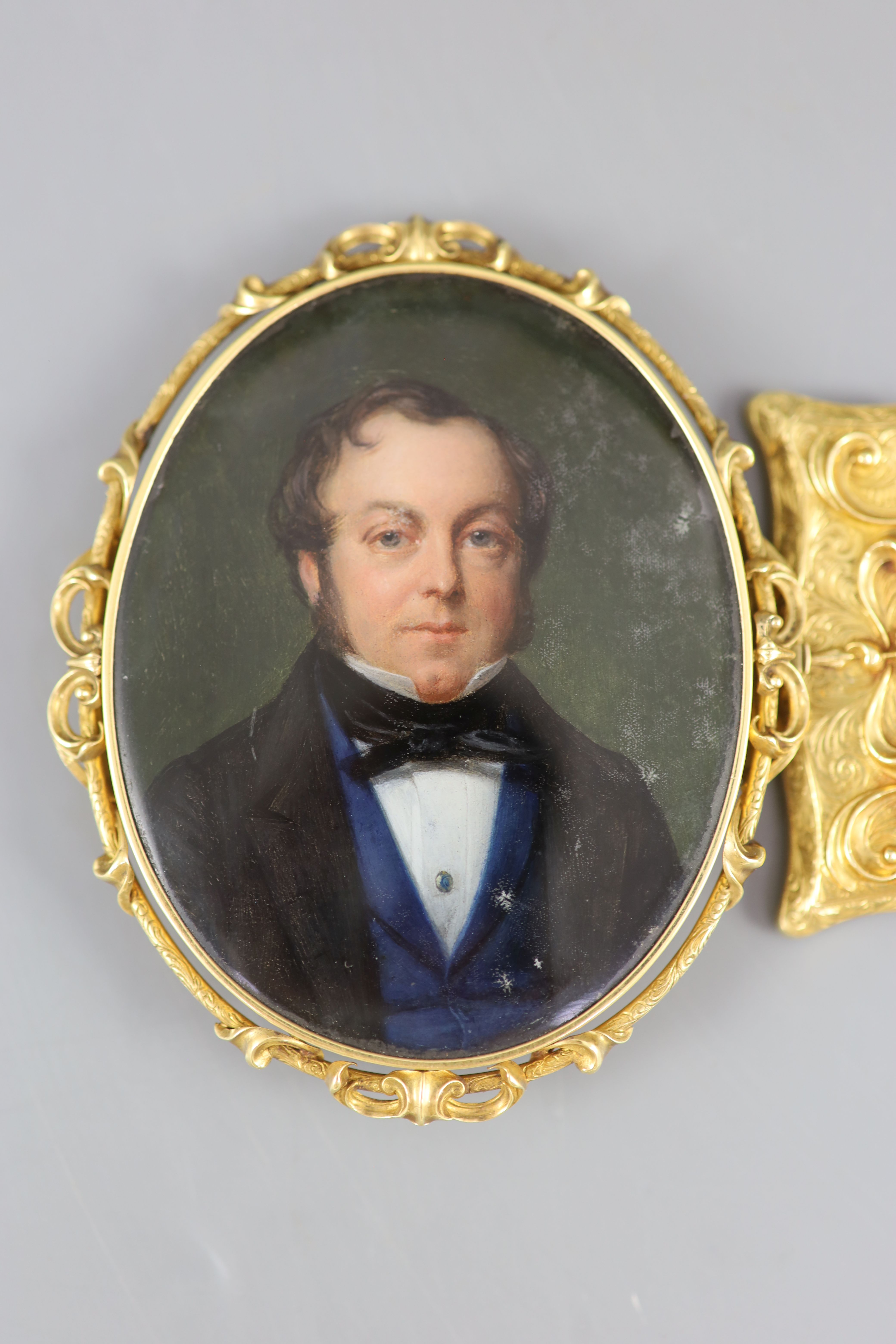 A Victorian oil on ivory portrait miniature of a gentleman, in a gold bracelet frame